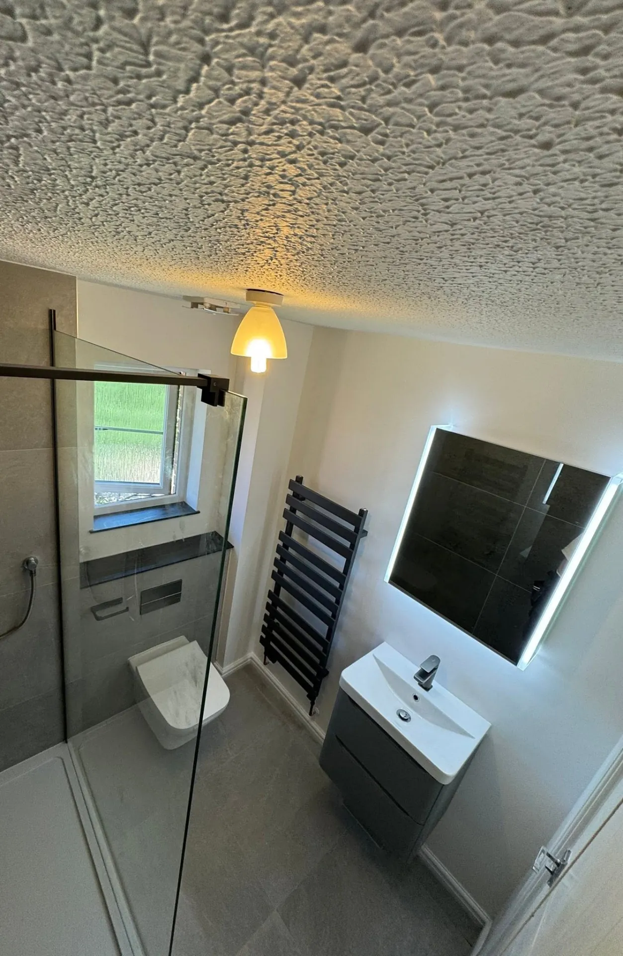 Bathroom installation by Space B Tiling: modern bathroom with shower, toilet and vanity