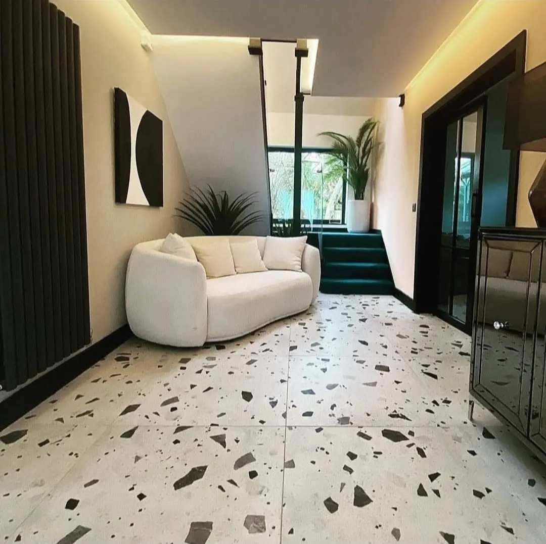 Floor tiling by Space B Tiling: terrazzo-effect large-format hallway floor tiles