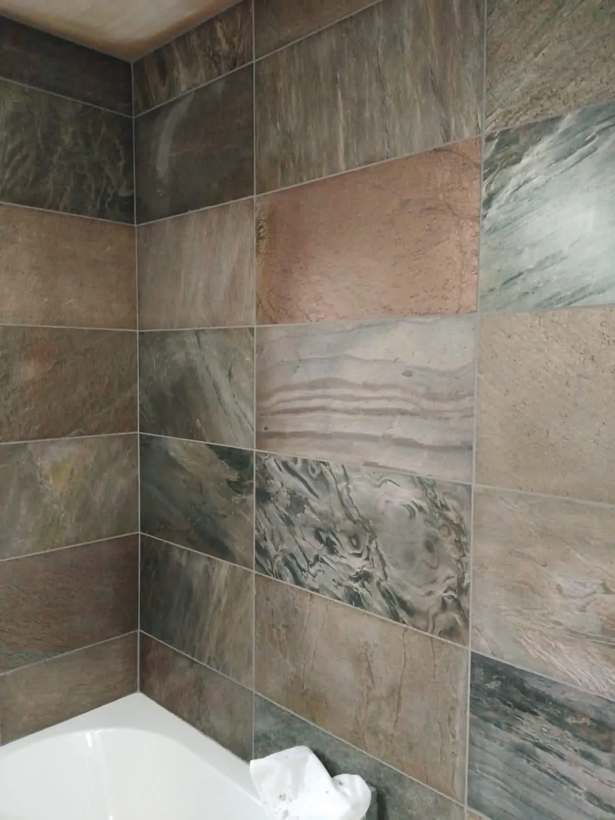 Wall tiling by Space B Tiling: multi-tone slate-effect wall tiles