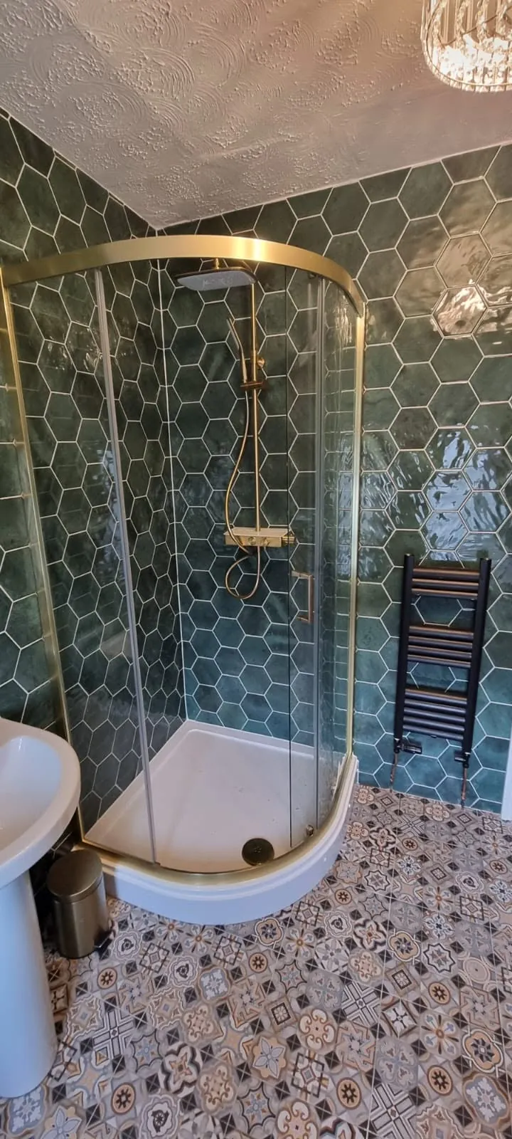 Bathroom installation by Space B Tiling: shower with green hexagonal feature tiles