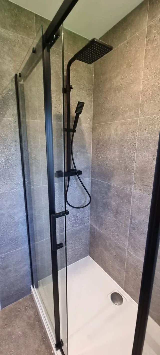 Bathroom installation by Space B Tiling: black-framed shower enclosure detail