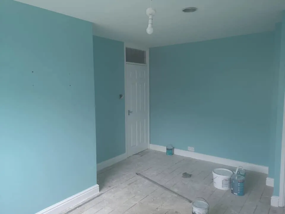 Painting by Space B Tiling: freshly painted blue room with white woodwork