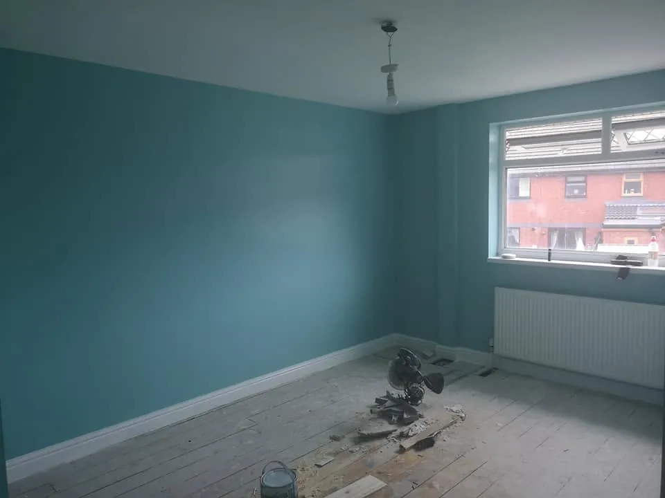 Painting by Space B Tiling: freshly painted teal bedroom walls